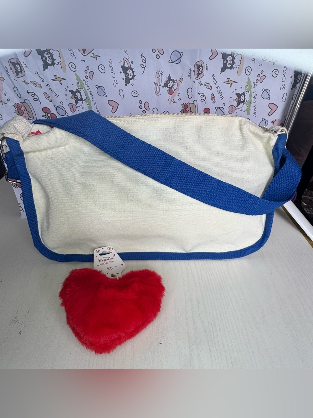 Hello Kitty Canvas Crossbody Bag in Red, Blue, Cream with Plush Red Heart Charm - Picture 3 of 8